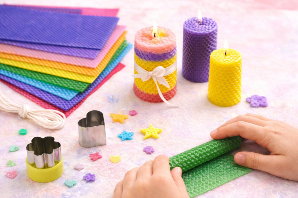 Kids making colorful beeswax candles with a DIY candle kit, rolling wax sheets into handmade Mother’s Day gifts