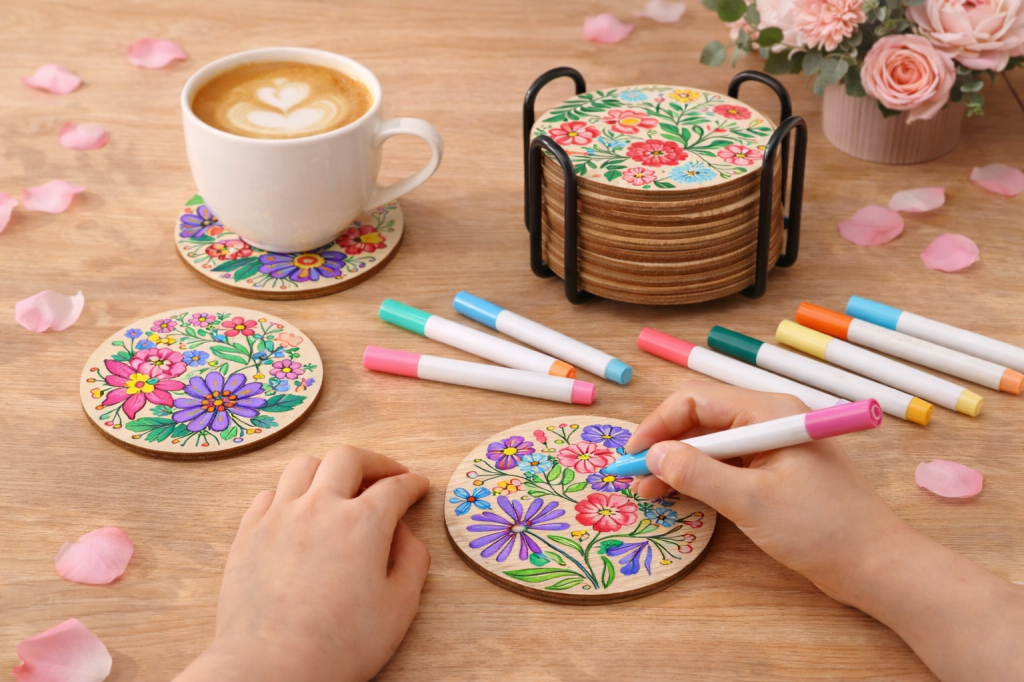 Kids decorating wooden floral coasters with markers, DIY Mother’s Day gift idea kids can make and moms can use daily